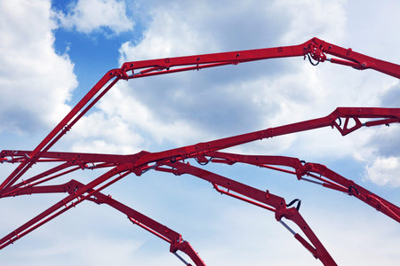 Part of a concrete pumps on a blue skyの写真素材