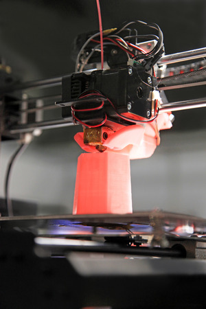 detail of 3d printer printing a plastic pieceの写真素材