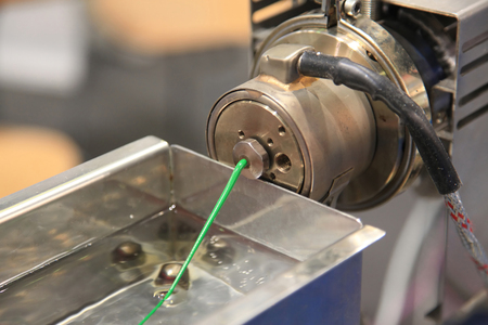 Plastic Wire Filament, the Modern printing technology. Continuous extrusion with cooling in water.の写真素材