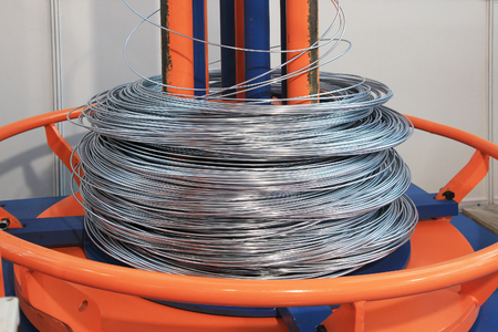 unwinding and feeding wire into the machine for alignment and cutting construction rebar unwinding and feeding wire into the machine for alignment and cutting construction rebar