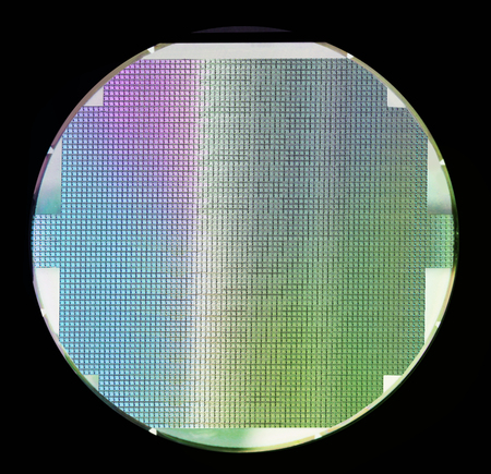 Silicon wafer with chips isolated on black backgroundの写真素材