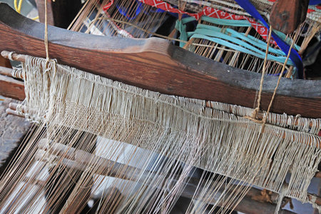 Close-up of ancient traditional hand weaving loom or weaving machine