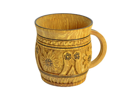 Wooden carved mug with pattern isolated on whiteの写真素材