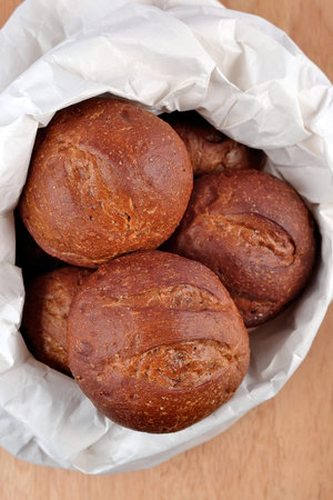 Fresh and delicious bread in a paper bag