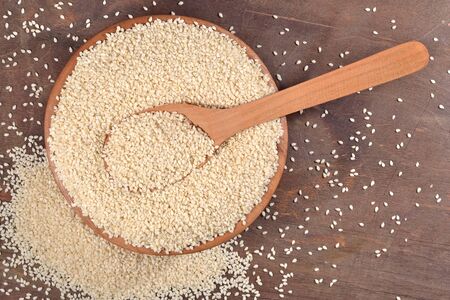 Sesame seeds in a wooden bowlの写真素材
