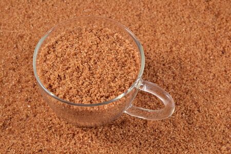 Brown sugar in a cupの写真素材