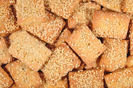Cookies with sesame seeds as background textureの写真素材