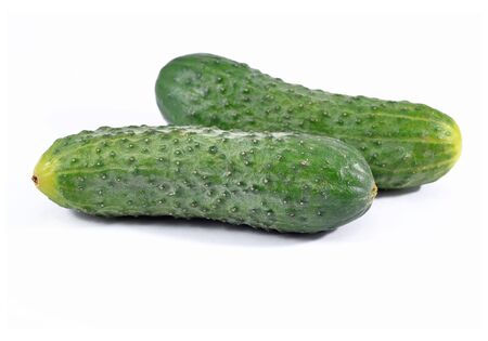 Two green cucumbers on white background.の写真素材