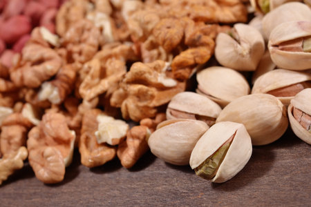 Close up of heap of assorted nuts  as background