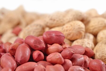 Heap of peanuts on a white backgroundの写真素材