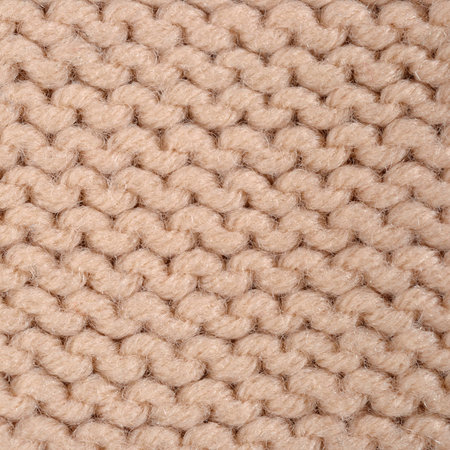 Beige knitted fabric texture background