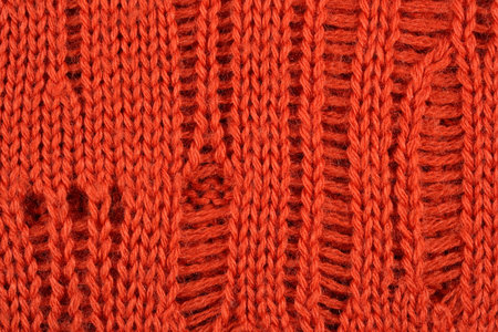 Orange knitted fabric texture background