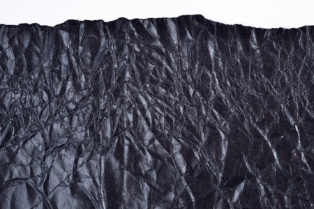 Ripped black crushed  paper with copy spaceの写真素材