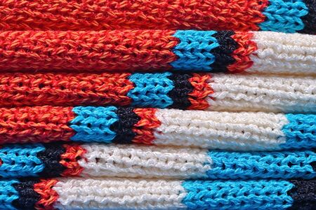 Stack of colourful knitted closeupの写真素材
