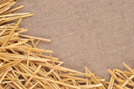 Straw on burlap as background textureの写真素材