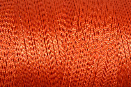 Spool of thread macro background texture