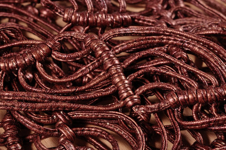 Macrame leather belts  close up as background