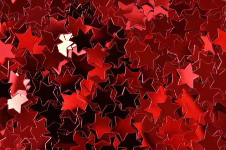 Confetti in the form of red stars as background textureの写真素材