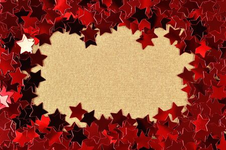 Frame of confetti in the form of red stars as background textureの写真素材