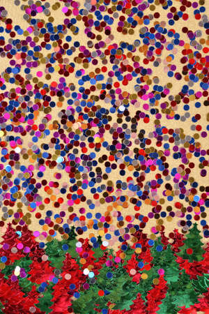 Varicolored confetti on a gold backgroundの写真素材