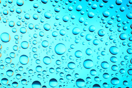 Macro of water drops on blue background
