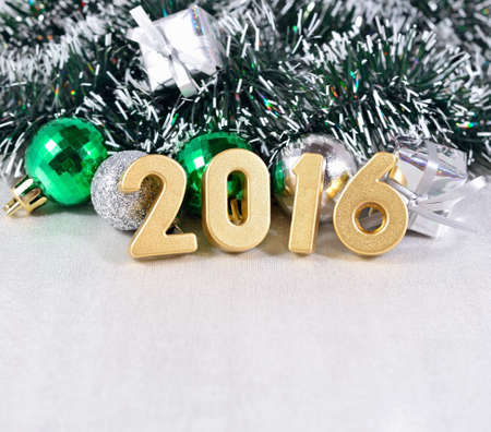 2016 year golden figures on the background of Christmas decorationsの写真素材
