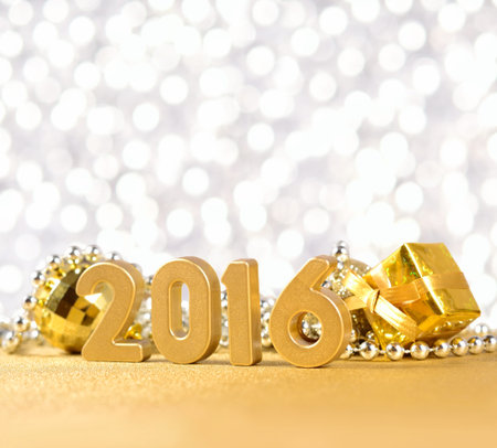 2016 year golden figures on the background of Christmas decorations