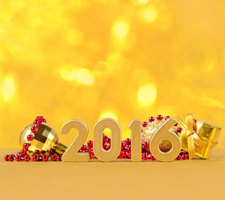 2016 year golden figures on the background of Christmas decorationsの写真素材