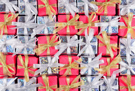 Top view of silver and red gifts as background