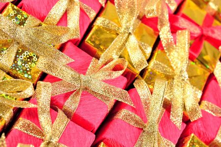 Top view of golden and red gifts as backgroundの写真素材