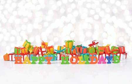 Happy holidays colorful text on the background of varicolored gifts on a bokeh backgroundの写真素材