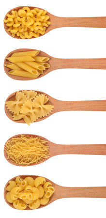 Set of italian pasta in a wooden spoon on a white backgroundの写真素材