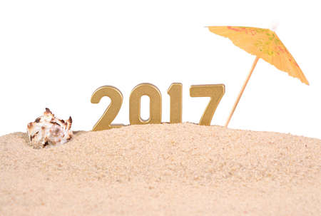 2017 year golden figures with seashell on a white backgroundの写真素材
