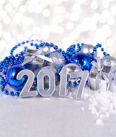 2017 year silver figures on the background of silvery and blue Christmas decorationsの写真素材