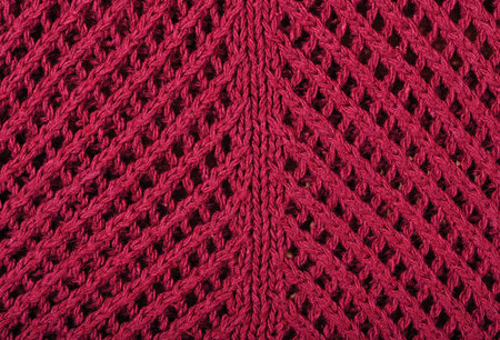 Dark red openwork stockinet as background texture