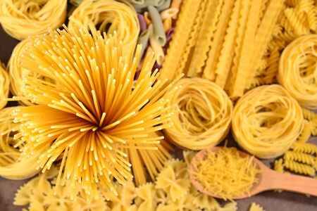 Assortment of uncooked Italian pasta close upの写真素材