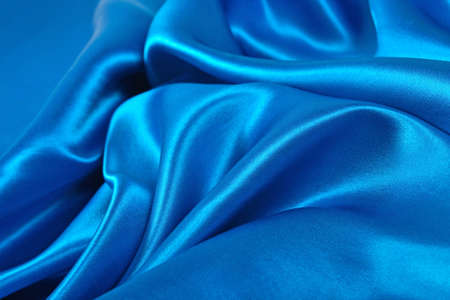 Natural blue satin fabric as background textureの写真素材