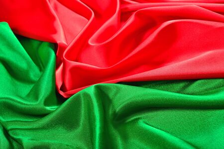 Natural red and green satin fabric as background textureの写真素材