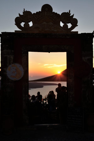 View of the famous island desantorini in greece at sunsetの写真素材