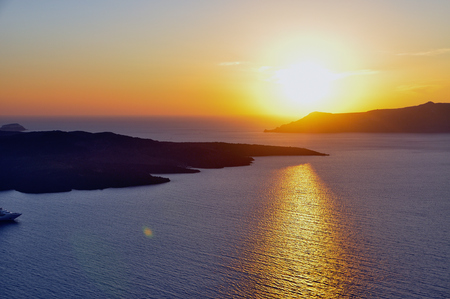 View of the famous island desantorini in greece at sunsetの写真素材