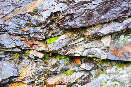 Close-up of wall made of different stonesの写真素材