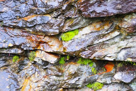 Close-up of wall made of different stonesの写真素材