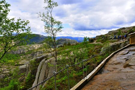 LYSEFJORD-NORWAY, 05JUNE-2017    tourists in preikestolen or pulpit in Norway on a day with cloudsclimb to the prektestolen or pulpit in Norwayclimb to the prektestolen or pulpit in Norwayのeditorial素材