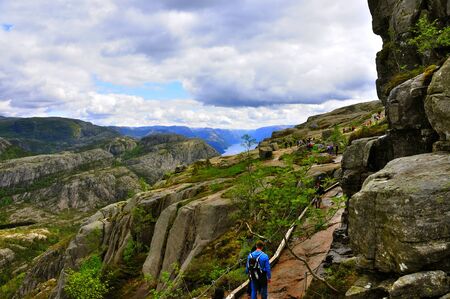 LYSEFJORD-NORWAY, 05JUNE-2017    tourists in preikestolen or pulpit in Norway on a day with cloudsclimb to the prektestolen or pulpit in Norwayclimb to the prektestolen or pulpit in Norwayのeditorial素材