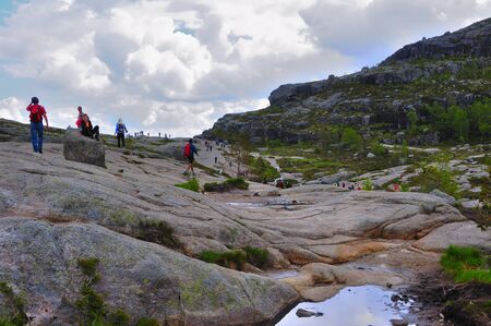 LYSEFJORD-NORWAY, 05JUNE-2017    tourists in preikestolen or pulpit in Norway on a day with cloudsclimb to the prektestolen or pulpit in Norwayclimb to the prektestolen or pulpit in Norwayのeditorial素材