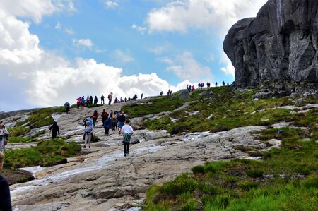 LYSEFJORD-NORWAY, 05JUNE-2017    tourists in preikestolen or pulpit in Norway on a day with cloudsclimb to the prektestolen or pulpit in Norwayclimb to the prektestolen or pulpit in Norwayのeditorial素材