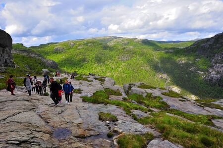 LYSEFJORD-NORWAY, 05JUNE-2017    tourists in preikestolen or pulpit in Norway on a day with cloudsclimb to the prektestolen or pulpit in Norwayclimb to the prektestolen or pulpit in Norwayのeditorial素材