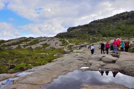 LYSEFJORD-NORWAY, 05JUNE-2017    tourists in preikestolen or pulpit in Norway on a day with cloudsclimb to the prektestolen or pulpit in Norwayclimb to the prektestolen or pulpit in Norwayのeditorial素材