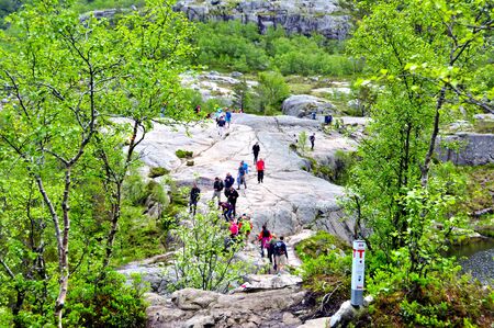 LYSEFJORD-NORWAY, 05JUNE-2017    tourists in preikestolen or pulpit in Norway on a day with cloudsclimb to the prektestolen or pulpit in Norwayclimb to the prektestolen or pulpit in Norwayのeditorial素材