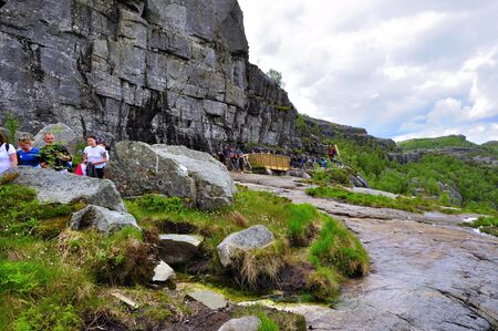 LYSEFJORD-NORWAY, 05JUNE-2017    tourists in preikestolen or pulpit in Norway on a day with cloudsclimb to the prektestolen or pulpit in Norwayclimb to the prektestolen or pulpit in Norwayのeditorial素材